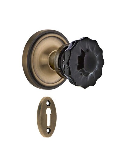 Classic Rosette Mortise Lock Set with Colored Fluted Crystal Glass Knobs Black in Antique Brass.